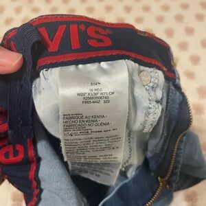 Levi’s straight jeans. Not quite wide leg. Has adjustable elastic waist.